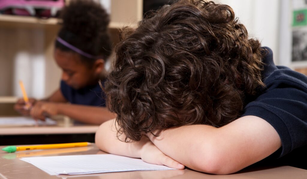 student with head down