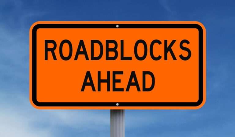 roadblocks ahead construction sign