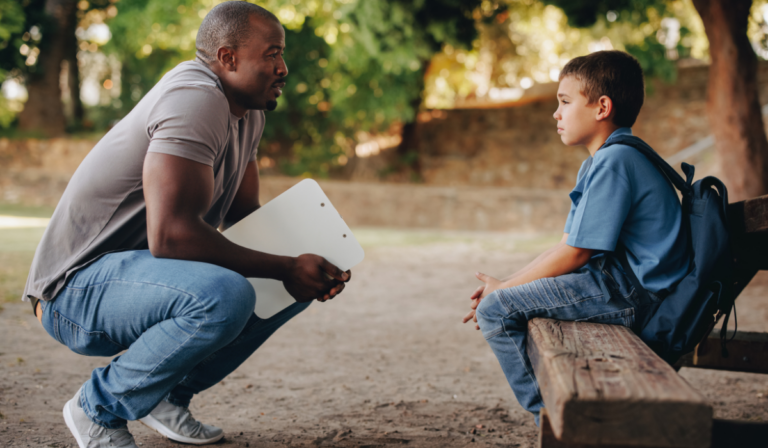 teacher student talking outside