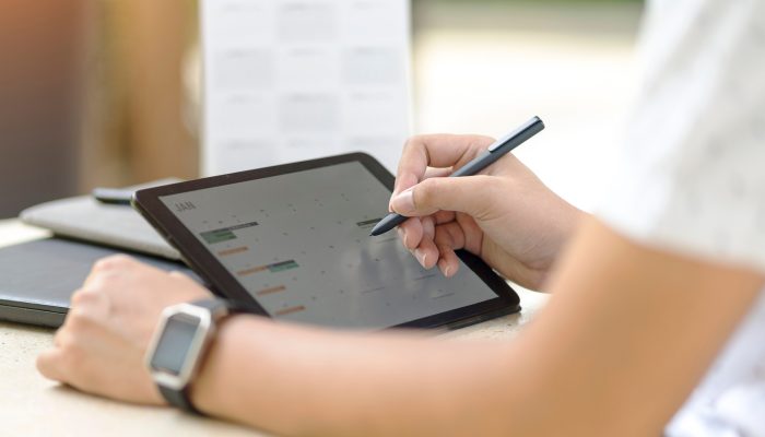 woman setting appointments on calendar