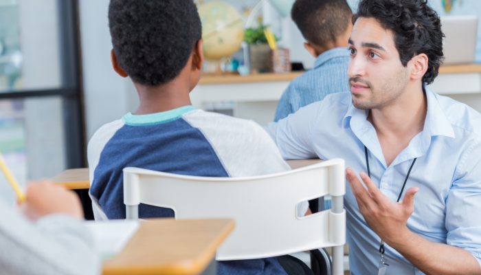 teacher discussing concerns with student