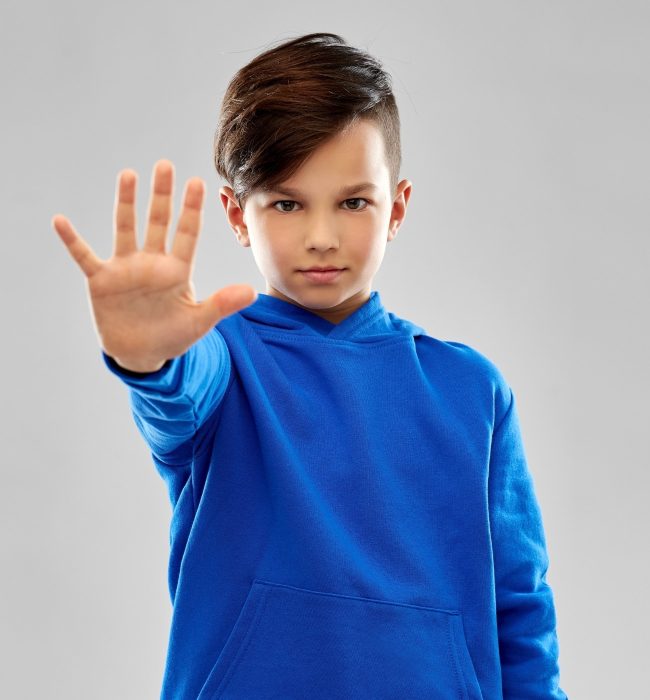 child setting boundaries, hand in stop motion