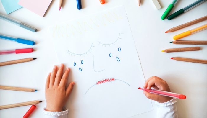 child's drawing of sad, crying face after having to accept 'no'