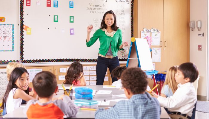 teacher in front of elementary class