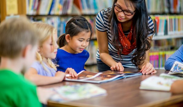 teacher helping students